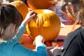 Kids carving pumpkins at Senator Scott Wieners Halloween Pumpkin Carving Event Royalty Free Stock Photo