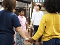 Kids in casual holding hands in a circle Royalty Free Stock Photo