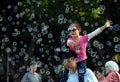 Kids catching and having fun and with soap bubbles