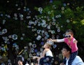 Kids catching and having fun and with soap bubbles