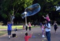 Kids catching and having fun and with soap bubbles