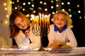 Kids celebrating Hanukkah. Festival of lights