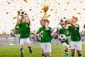 Kids celebrating sports success. Victory of children football team in tournament final game. Happy boys Royalty Free Stock Photo