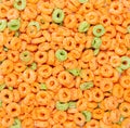 Kids cereal generic apple jacks orange and green puffed circle shaped Royalty Free Stock Photo