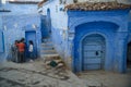Kids in Chefchaouen, the blue city in the Morocco.
