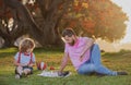 Kids chess school. Father and son playing chess lying on grass at lawn park. Fathers Day, love family, parenthood Royalty Free Stock Photo