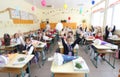 Kids in classroom in primary school, blurred