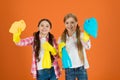 Kids cleaning together. Nice and tidy. Girls with mist spray and rag ready for cleaning. Household duties. Little helper Royalty Free Stock Photo