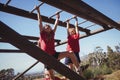 Kids climbing monkey bars during obstacle course training Royalty Free Stock Photo