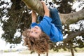 Kids climbing trees, hanging upside down on a tree in a park. Child protection. Royalty Free Stock Photo