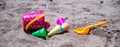 Kids colorful toys in a sand in a summer beach Royalty Free Stock Photo