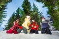 Kids competes in throwing snowballs at winter wood Royalty Free Stock Photo