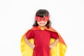 Kids concept, smiling girl playing super hero on white background Royalty Free Stock Photo