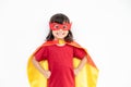 Kids concept, smiling girl playing super hero on white background Royalty Free Stock Photo