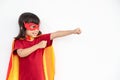 Kids concept, smiling girl playing super hero on white background Royalty Free Stock Photo