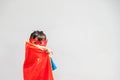 Kids concept, smiling girl playing super hero on white background Royalty Free Stock Photo