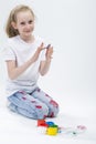 Kids Concepts. Portrait of Funny Young Girl With Brightly Painted Hands
