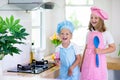 Kids cook in white kitchen. Children cooking Royalty Free Stock Photo