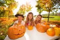 Kids in costumes during Halloween craft pumpkins