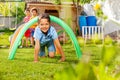 Kids crawl under barriers in a competitive game Royalty Free Stock Photo