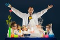 Kids with crazy professor doing science experiments in the laboratory Royalty Free Stock Photo