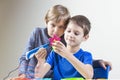 Two boys creating with 3d printing pen Royalty Free Stock Photo