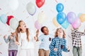 Kids dancing with balloons Royalty Free Stock Photo