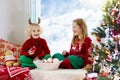 Kids decorate Christmas tree. Child on Xmas eve Royalty Free Stock Photo