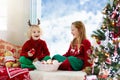 Kids decorate Christmas tree. Child on Xmas eve Royalty Free Stock Photo