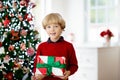 Kids decorate Christmas tree. Child on Xmas eve Royalty Free Stock Photo