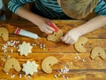Kids decorate gingerbread cookies for the holiday