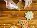 Kids decorate gingerbread cookies for the holiday