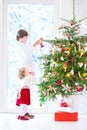 Kids decorating Christmas tree Royalty Free Stock Photo