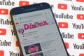 Kids Diana Show official youtube channel on smartphone screen on paper youtube background