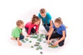 Kids of different age solving jigsaw puzzle together Royalty Free Stock Photo