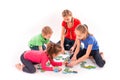 Kids of different age solving jigsaw puzzle together Royalty Free Stock Photo