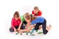 Kids of different age solving jigsaw puzzle together Royalty Free Stock Photo