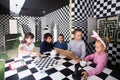 kids discuss the game in the chess quest room Royalty Free Stock Photo