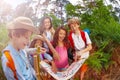 Kids discussing map during summer navigation game Royalty Free Stock Photo