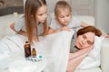 Kids do not interfere with sick mother sleep. Royalty Free Stock Photo