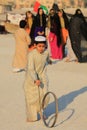 Kids at Doha beach wearing traditional Arabian cloths