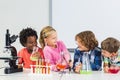 Kids doing a chemical experiment in laboratory Royalty Free Stock Photo