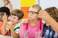 Kids doing a chemical experiment in laboratory Royalty Free Stock Photo