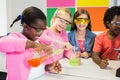 Kids doing a chemical experiment in laboratory Royalty Free Stock Photo