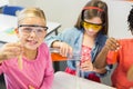 Kids doing a chemical experiment in laboratory Royalty Free Stock Photo