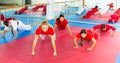 Kids doing warming up before martial arts training Royalty Free Stock Photo