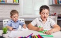 Kids draw at home together. Children are painting in kindergarten. Royalty Free Stock Photo