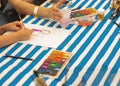 Kids draw with parents paint beautiful pictures, children`s creativity