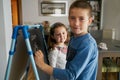 Kids draw a virus on the blackboard at home