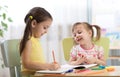 Kids drawing in kindergaten. Children painting in nursery. Preschooler with pen at home. Creative toddlers. Royalty Free Stock Photo